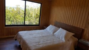 Postel nebo postele na pokoji v ubytování Cabaña Quiquel, Dalcahue, Chiloe