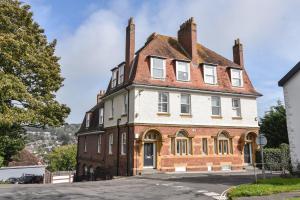 an old brick house with a turret at Lyme Zest in Lyme Regis