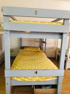 a bunk bed with two numbers on top of it at Home Away From Home in Cape Town