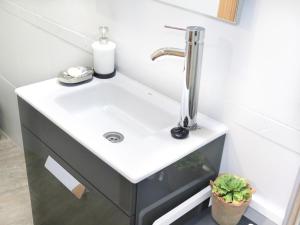 a bathroom with a sink and a faucet at Paz y calma en Madrid centro in Madrid
