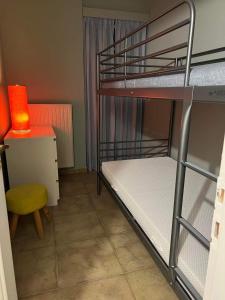 Ένα ή περισσότερα κρεβάτια σε δωμάτιο στο Vicky's place