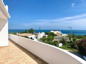 a view of the ocean from the balcony of a house at Casa Katarina in Luz +7 photos