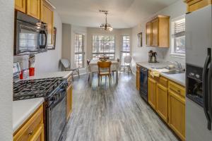 a kitchen with a table and a dining room at Ideally Located Austin Home with Fenced-In Yard! in Austin