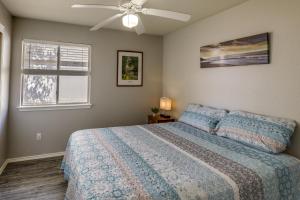 a bedroom with a bed and a ceiling fan at Ideally Located Austin Home with Fenced-In Yard! in Austin