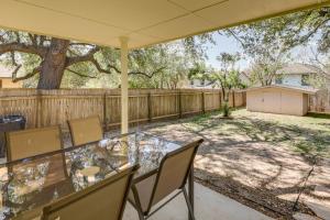 a patio with a table and chairs and a fence at Ideally Located Austin Home with Fenced-In Yard! in Austin