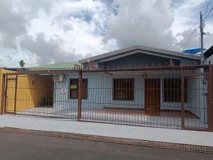 a building with a fence in front of it at Apartamentos M&M in Fortuna