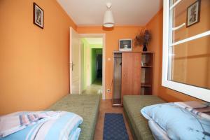 Ένα ή περισσότερα κρεβάτια σε δωμάτιο στο WYNAJEM POKOI Halina Ciesielska