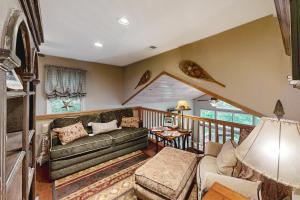a living room with a couch and a table at Pisgash Cottage in Pisgah Forest