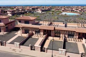 an aerial view of a resort with a swimming pool at Dreamsville Fuerteventura a 5 minutos de Lajares in Lajares