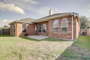 a brick house with a large window on a yard at 4 Mi to Six Flags Spring Vacation Home in Spring
