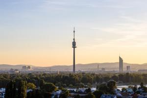 a view of the city of berlin with the tv tower at Citadines Danube Vienna in Vienna