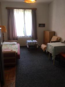 a room with two beds and a window at Apartment Trojska in Prague