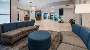 a lobby of a hospital with couches and chairs at Best Western Plus Wausau Tower Inn in Wausau