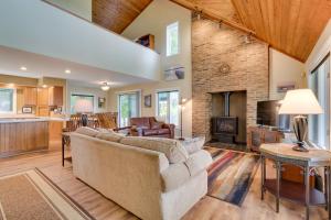 a living room with a couch and a fireplace at WolcottandPort Bay Lakehouse Your Haven on the Bay! in Wolcott