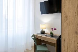 TV o dispositivi per l'intrattenimento presso The HeArt Guest House