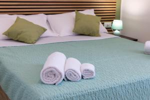 Letto o letti in una camera di The HeArt Guest House