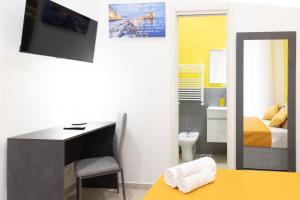 TV o dispositivi per l'intrattenimento presso The HeArt Guest House