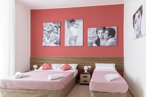 Letto o letti in una camera di The HeArt Guest House