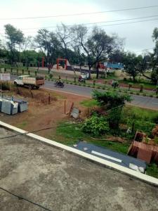 a view of a street with a truck on a road at home sweet home in Bhopal