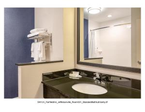 a bathroom with a sink and a mirror at Fairfield Inn & Suites by Marriott Jeffersonville I-71 in Jeffersonville