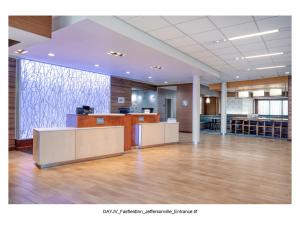 an office with a large room with wooden floors at Fairfield Inn & Suites by Marriott Jeffersonville I-71 in Jeffersonville