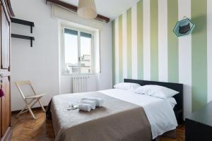 A bed or beds in a room at Casa di Crissy - centro Como