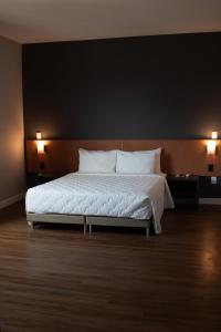 Katil atau katil-katil dalam bilik di Comfort Hotel Presidente Prudente