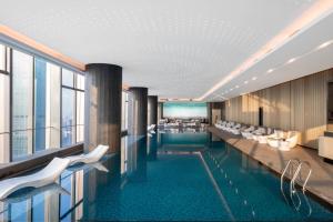a rendering of a hotel lobby with a pool at Renaissance Shenzhen Bay Hotel in Shenzhen