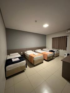 Postel nebo postele na pokoji v ubytování Shafira Hotel
