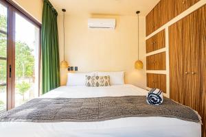Postel nebo postele na pokoji v ubytování Tulum Jungle Villas - Villa Jaguar