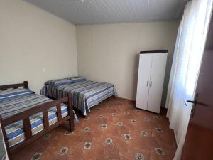 Ένα ή περισσότερα κρεβάτια σε δωμάτιο στο Sitio da Bisa