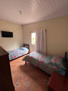 Ένα ή περισσότερα κρεβάτια σε δωμάτιο στο Sitio da Bisa