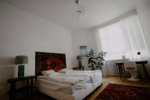 Posteľ alebo postele v izbe v ubytovaní Space Age Residence
