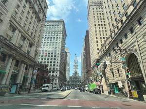 an empty street in a city with tall buildings at 304Stunning and comfy 1BDR APT in Center city in Philadelphia