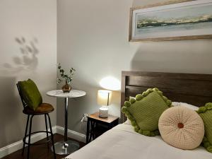 a bedroom with a bed and a table and a chair at 304Stunning and comfy 1BDR APT in Center city in Philadelphia