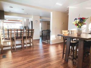 a dining room and kitchen with a table and chairs at Fireweed House in Fairbanks