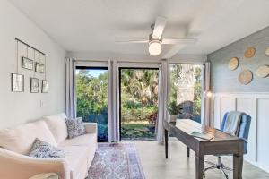 a living room with a couch and a table at 1207 Lagoon Villas in Amelia Island