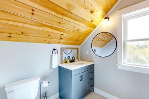 a bathroom with a sink and a mirror at Ridgeview in Whitefield +55 photos