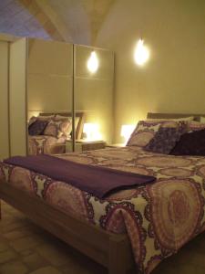 Un pat sau paturi într-o cameră la La Grotta