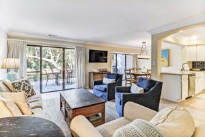 a living room with a couch and a table at 2129 Beach Wood in Amelia Island