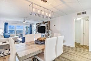 a dining room and living room with a table and chairs at Amelia South C3 in Amelia Island