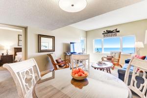 a living room with a table and chairs at 247 Sandcastles in Amelia Island