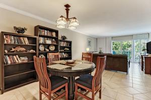 a dining room with a table and chairs at 2123 Beach Wood in Amelia Island