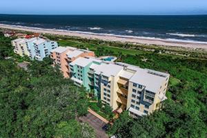an overhead view of a row of buildings next to the beach at 1380 Shipwatch in Amelia Island