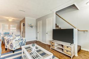 a living room with a large flat screen tv at 2810 Ohio Avenue #3 in Amelia Island