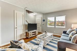 a living room with a couch and a tv at 2810 Ohio Avenue #3 in Amelia Island