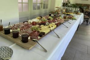 a buffet of food on a long table at Gemütliche 1 Zimmerwohnung in Sankt Radegund bei Graz