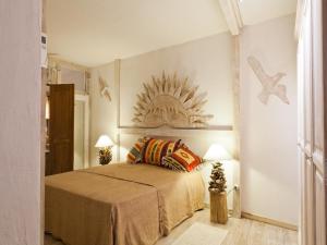 A bed or beds in a room at Smart Appart Villa Patrizia