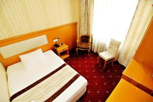 a hotel room with a bed and a chair at Ilıcak Hotel in Istanbul +22 photos