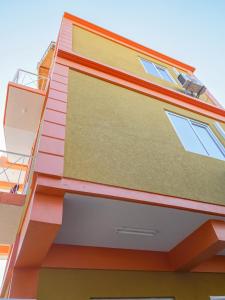 a facade of a building with colorful paint at RJ Residences in Roseau